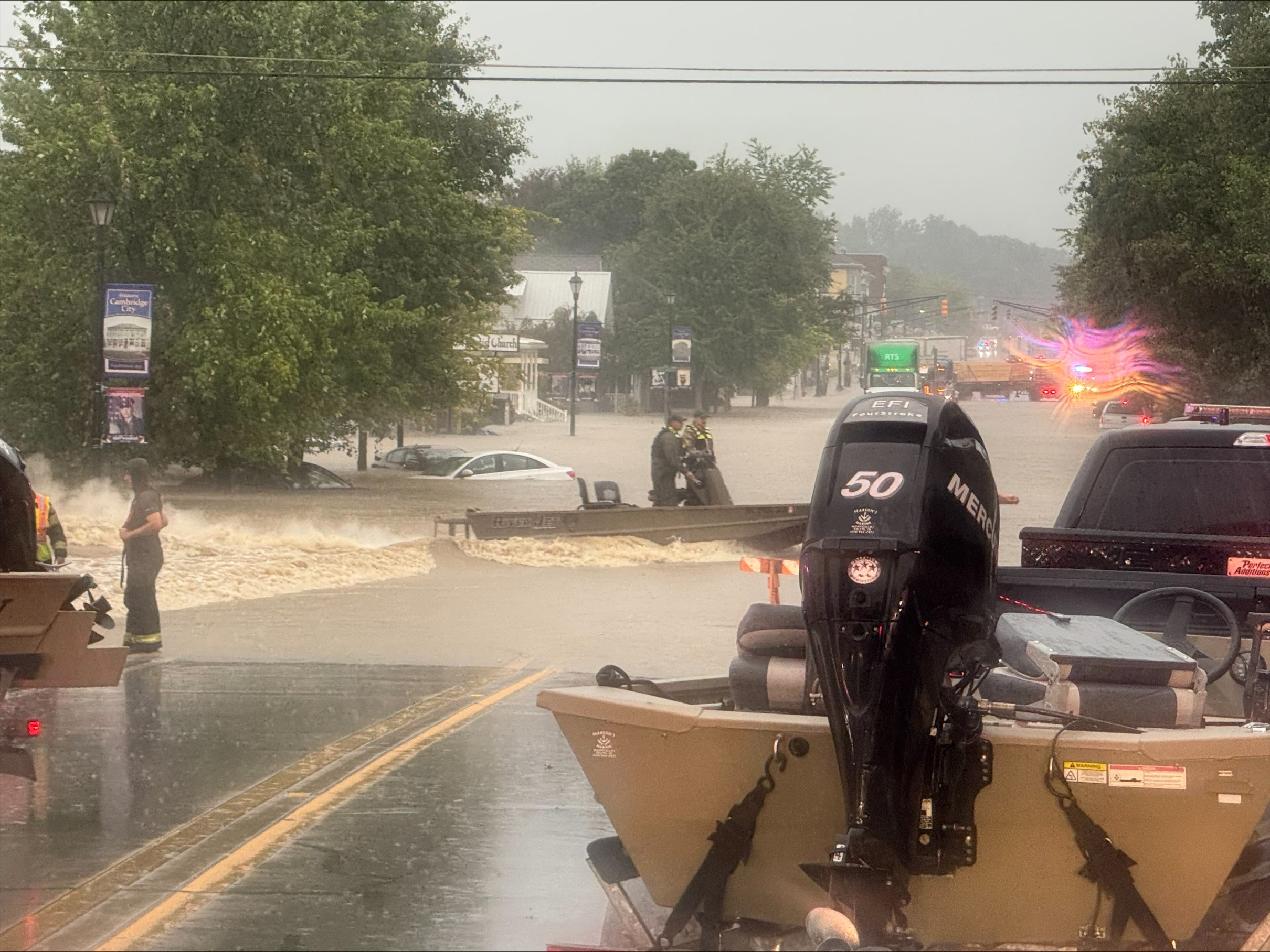 PHOTOS | Floodwaters sweep away cars, block roads across Indiana